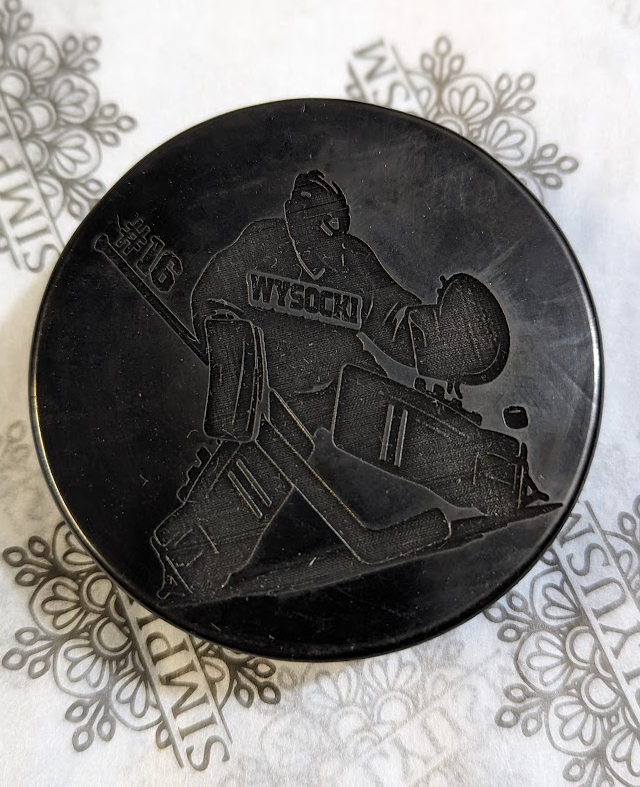 Get your game on with this Laser Engraved Hockey Puck! Perfect for fans and players alike, this puck adds a unique touch to any game.